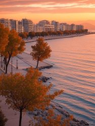 a vibrant depiction of Patras’ coastal skyline with the Roman Odeon and an autumnal touch to reflect the September setting